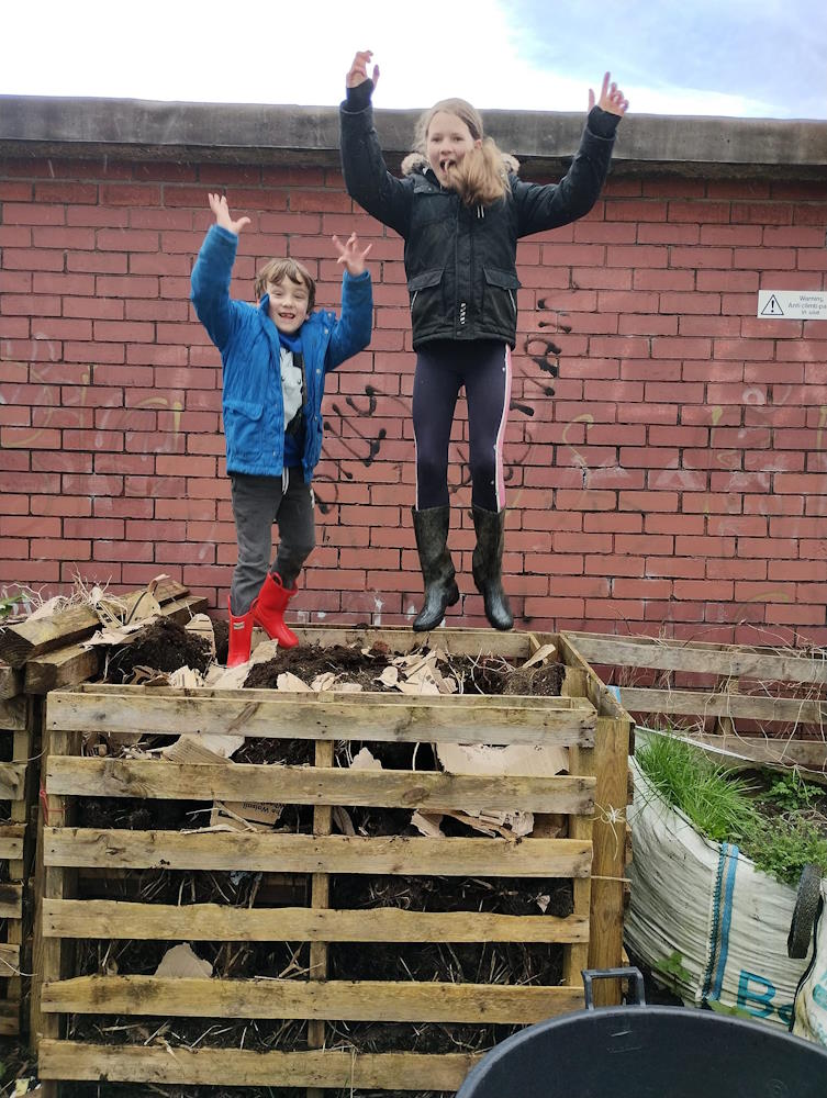click to see larger image making raised beds and bird feeders at the newbold community growing together community garden