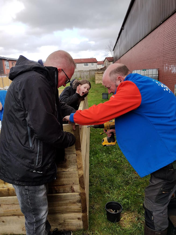click to see larger image making raised beds and bird feeders at the newbold community growing together community garden