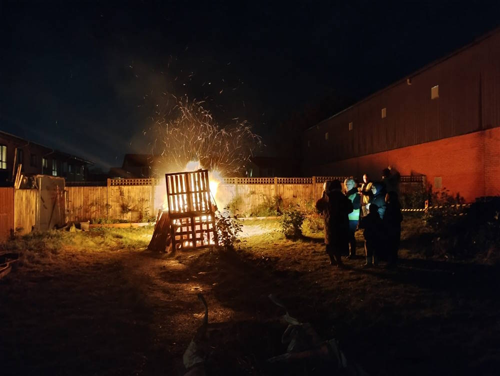 click to see larger photograph bonfire party at the community garden