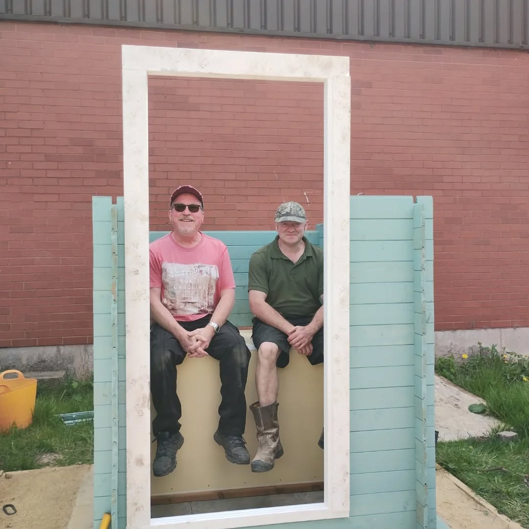 click to see larger image clementis flowering and new toilet being constructed at the newbold community growing together community garden