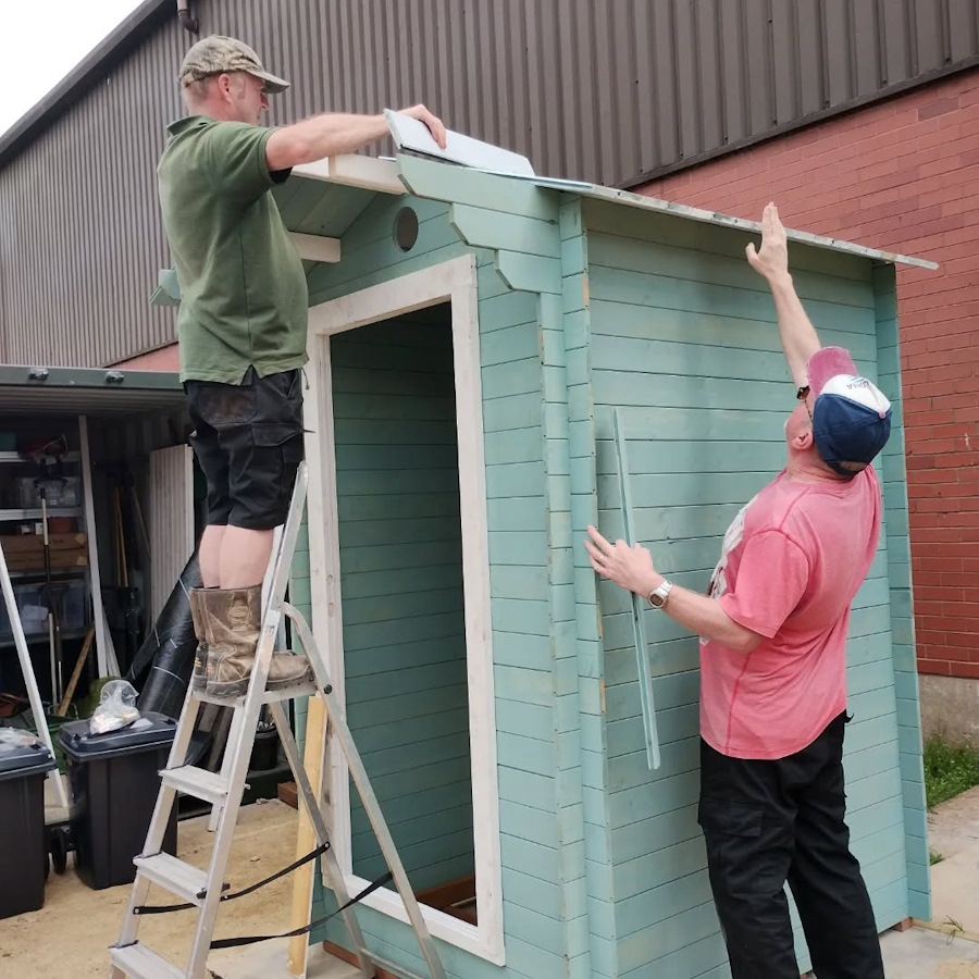 click to see larger image clementis flowering and new toilet being constructed at the newbold community growing together community garden