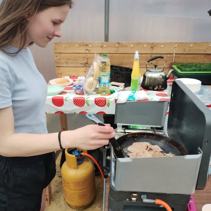 click to see larger image clementis flowering and new toilet being constructed at the newbold community growing together community garden