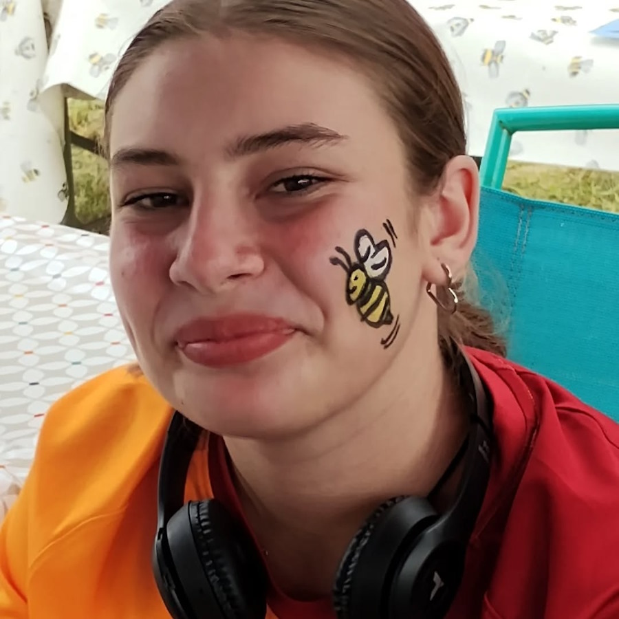 click to see more images face painting in the community garden