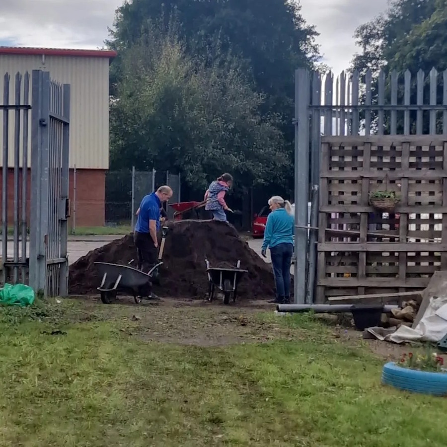 click to see larger image great work moving compost in the community garden