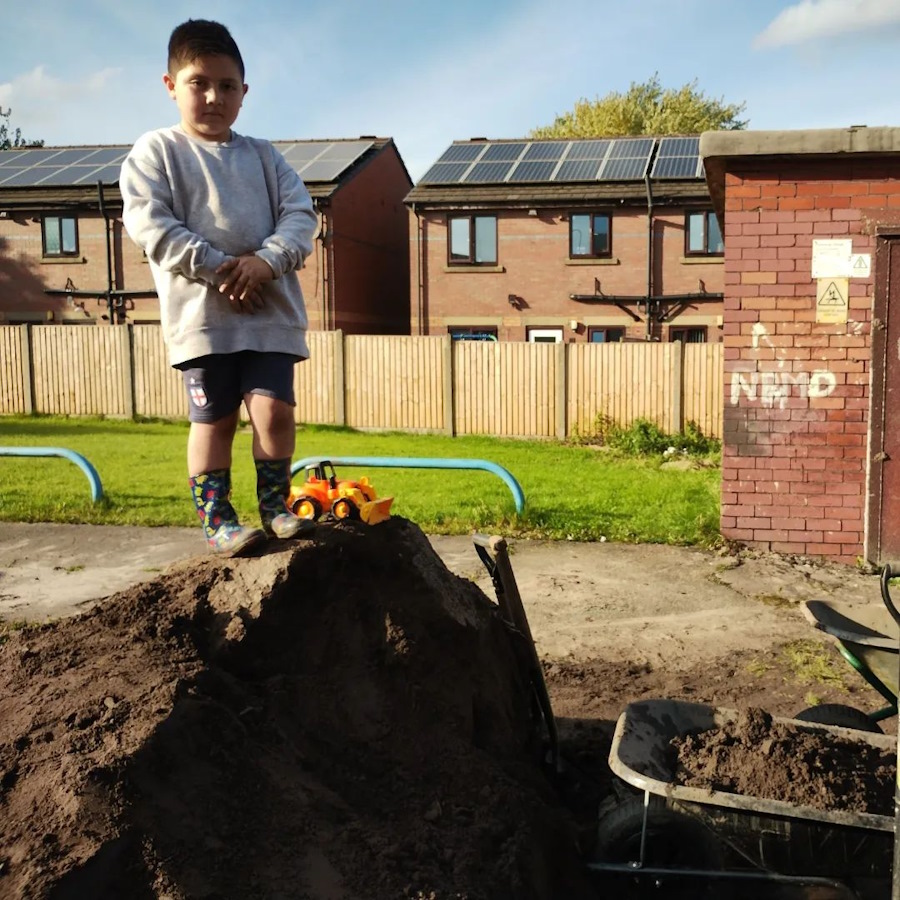 click to see larger image more barrowing of compost in the community garden